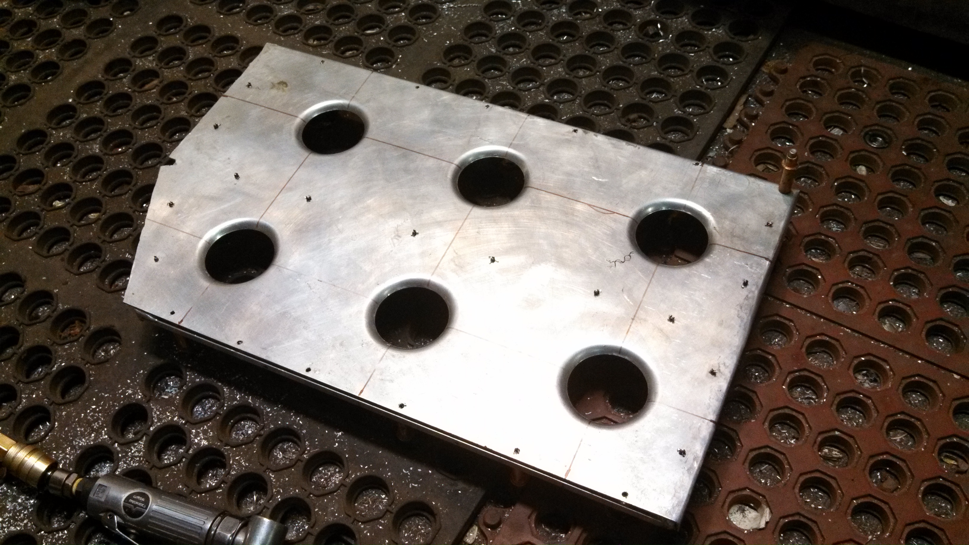 pass footrest with dimple die holes.jpg