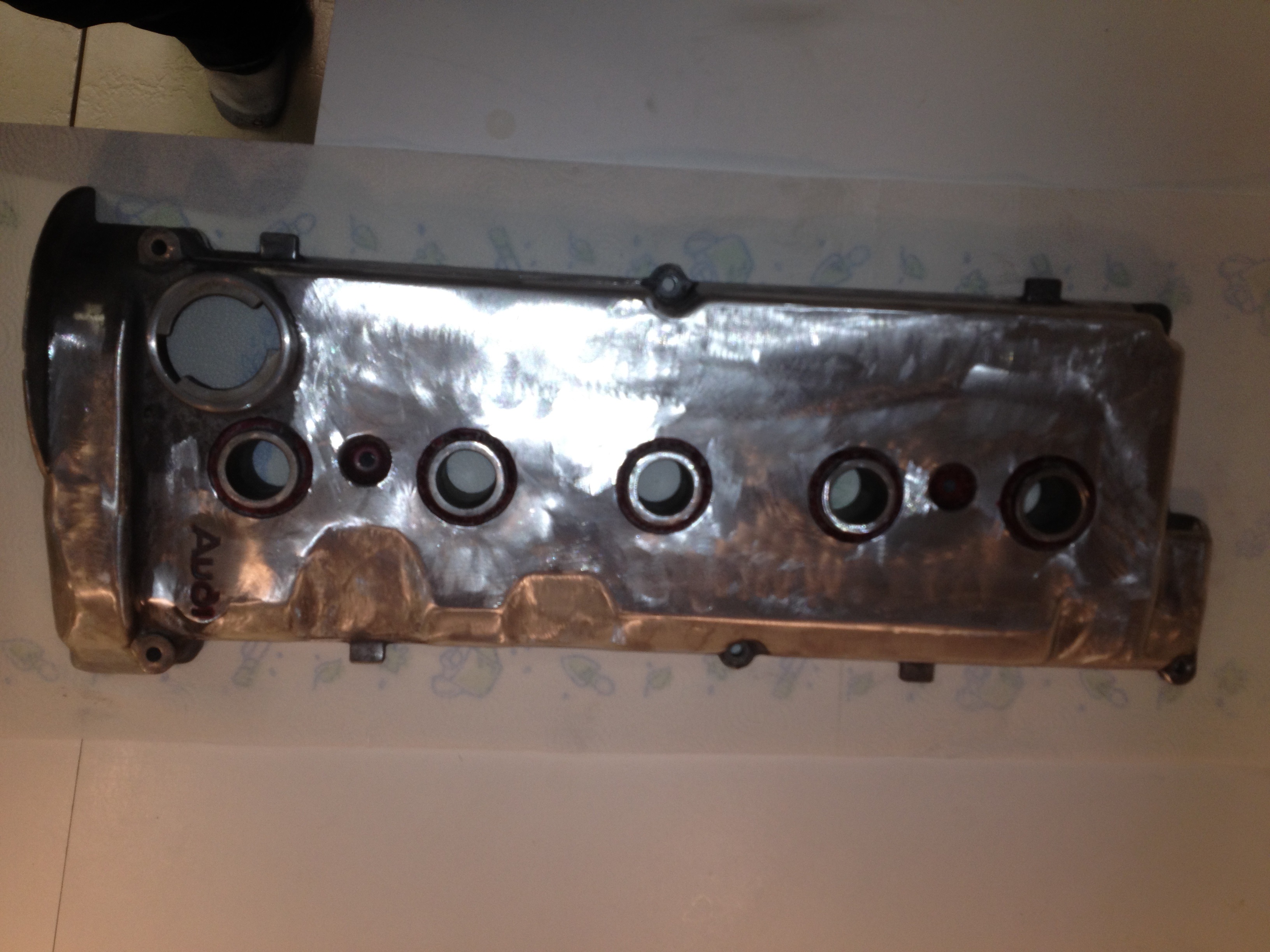 taking grinder to valve cover and cooling fins.jpg
